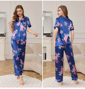 Detail of floral silk pajama set featuring short sleeves and long pants with floral print