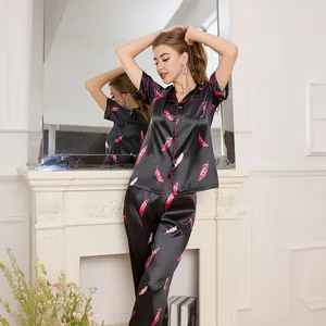 Women's black ice silk pajama set with pink feather print and short sleeve shirt