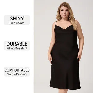 Plus size black satin slip dress with cowl neck featuring smooth and glossy fabric