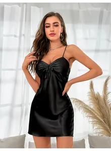 Detail of black silk satin slip dress featuring lace-up ruched bust and thin straps