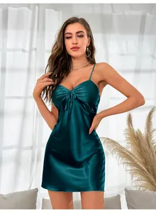 Close-up of dark green ice silk nightgown featuring V-neck pleats and bow decoration