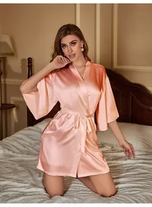 Detailed view of silk satin peach pink robe with kimono sleeves and belted waist design
