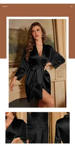 Detail of black satin kimono robe showing smooth fabric texture and elegant waist tie