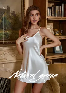 Close-up of elegant white silk camisole nightdress with deep V-neck and satin finish