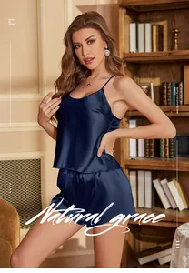 Detail of dark blue satin sleepwear set with camisole top and matching shorts