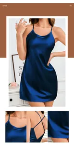 Detail of navy blue satin nightdress showing crossover back straps and silky fabric texture