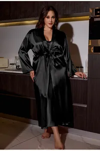 Detail of elegant black satin long sleeve robe with matching belt and inner slip dress