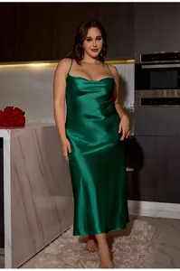 Detail of cowl neck draped emerald green satin nightgown with slim straps on model