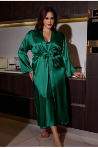 Detail of emerald green satin robe showing silky fabric texture and waist tie
