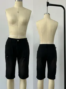 Detailed front and back view of men's slim fit black ripped denim shorts with knee length