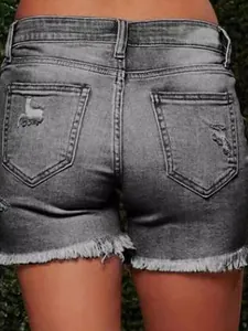 Women's dark gray distressed denim shorts with back pocket rip and frayed raw hem
