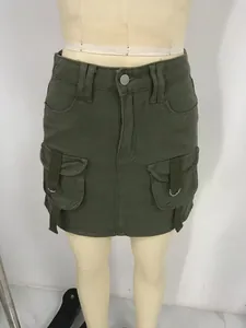 Detail view of military green cargo mini skirt with large side flap pockets and D-ring straps