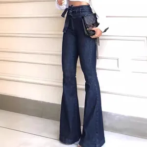 Slim fit high waisted flare jeans in dark blue denim featuring a matching waist belt