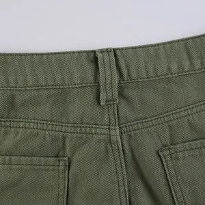 Detail of army green twill fabric with reinforced stitching and belt loops on back waist