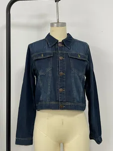 Detailed front view of a slim-fit dark blue denim jacket with flap pockets and buttons