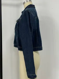Side view of dark wash cropped denim jacket featuring yellow contrast stitching and pockets