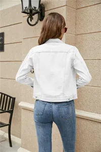Slim fit white denim jacket for women featuring back seams and adjustable waist tabs
