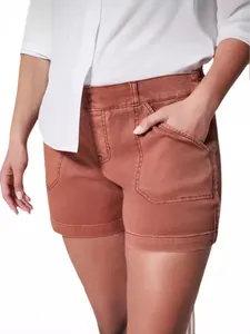 Women's vintage rust red high-waisted denim shorts with large utility patch pockets
