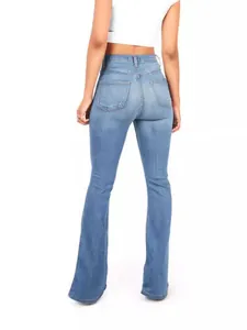 Slim fit high waisted light blue flare jeans for women shown from a back view perspective