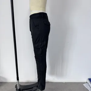 Detail of black slim motorcycle cargo pants with side flap pockets and pleated knee panels