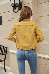 Detail view of the vibrant yellow denim jacket back showing classic vertical stitching lines