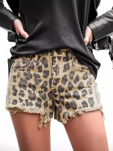 Women's vintage leopard print high waist denim shorts with frayed hems and ripped details