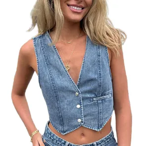 Detail of light blue denim vest with V-neckline and three metal buttons for women