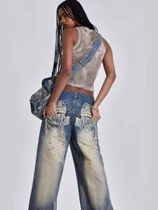 Women's vintage blue wide leg jeans with wings print and retro Y2K streetwear design