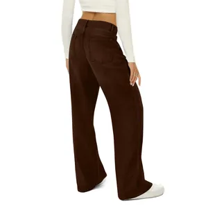 Detail of high waisted wide leg jeans in dark brown with symmetric back pockets