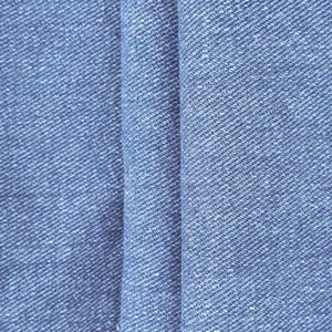 Detailed macro view showing blue denim twill fabric texture of men's casual overalls