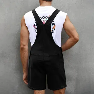 Rear view of men's black denim overalls featuring Y-back straps and functional back pockets