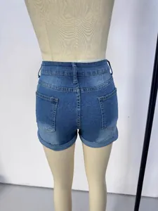 Women's high-waisted distressed denim shorts in light blue wash with rolled hems
