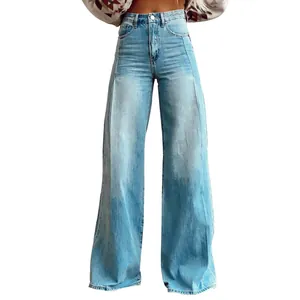 Detail of high-waisted wide-leg jeans with front seam design and faded blue wash