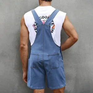 Detail view of denim overall shorts with back pockets and graphic print t-shirt for men