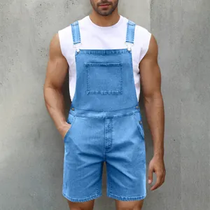 Detail of light blue denim overalls for men with metal buckles and chest pocket
