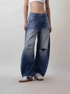Vintage blue high waist wide leg ripped jeans for women with street style washed details
