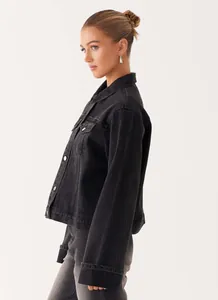 Detail of vintage washed grey denim jacket showing lapel collar and chest pockets