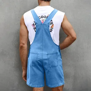 Back view of men's denim overalls shorts with suspenders and back pockets on grey wall
