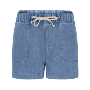 Detail of light blue denim shorts featuring elastic drawstring waist and front patch pockets