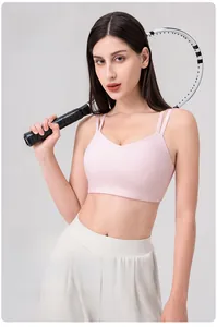 Detailed view of pink sports bra with Lycra fabric, thin straps and a stylish V-neck design