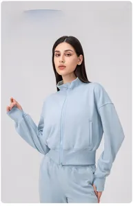 Detail of light blue high neck sports jacket with double zipper and ribbed texture