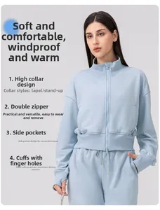 Detail view of double-way zipper and high collar on light blue women sports jacket