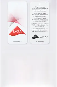 Detail of authentic LYCRA SPORT fabric hangtag with multilingual functional description