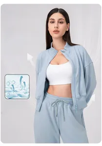 Detail of light blue quick-dry yoga jacket showing breathable and elastic fabric