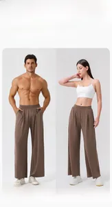 Detailed view of unisex high-waisted dark brown wide leg pants with premium drape fabric