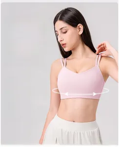 Detail of high-stretch Lycra fabric and thin straps on the pink sports yoga bra