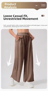 Detail showing the brown wide-leg yoga pants with soft drape fabric and loose fit design