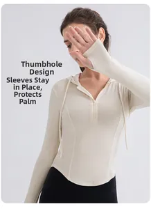 Detail view of the ribbed fabric thumb hole cuff on a women's slim yoga hoodie