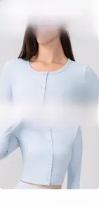 Close-up of the light blue yoga cardigan with round neck and matching delicate buttons