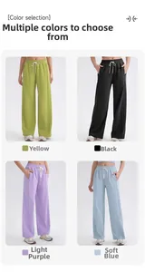 Detalle de pantalones de yoga de talle alto en verde lima, negro, violeta claro y azul suave